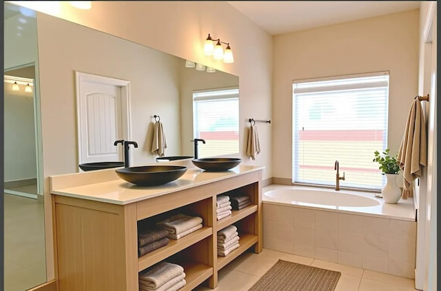 7285 W San Jose Ave, Fresno, CA 93723 - bathroom featuring a garden tub, double vanity, and tile patterned floors