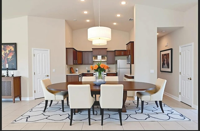 7285 W San Jose Ave, Fresno, CA 93723 - dining space featuring baseboards, light tile patterned floors, high vaulted ceiling, and recessed lighting