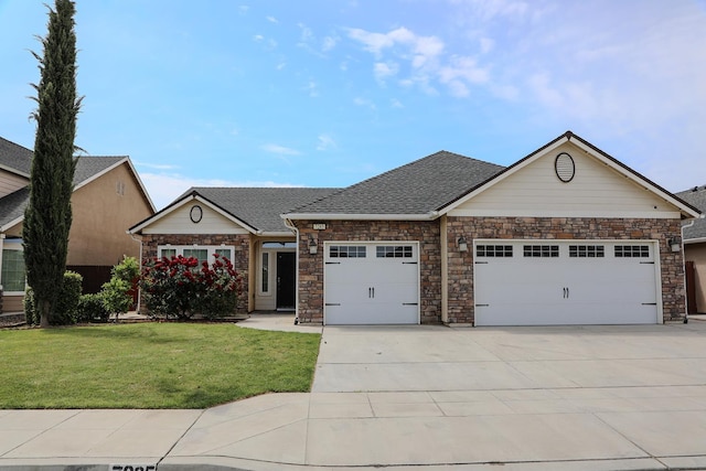 7285 W San Jose Ave, Fresno, CA 93723 - view of front of house featuring a garage, concrete driveway, a front lawn, stone siding, and roof with shingles