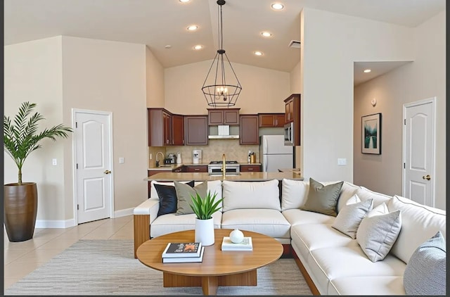 7285 W San Jose Ave, Fresno, CA 93723 - living room featuring a chandelier, light tile patterned floors, baseboards, recessed lighting, and high vaulted ceiling