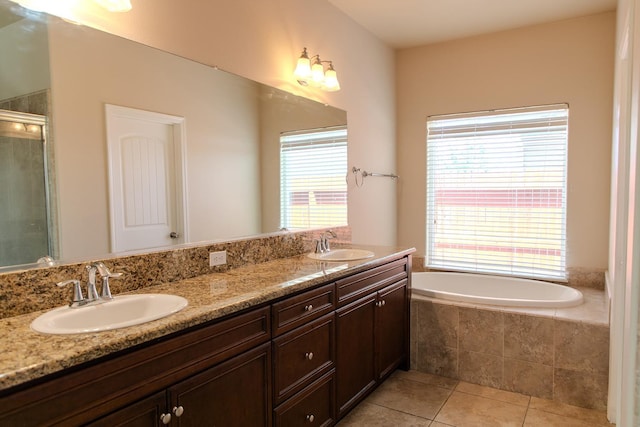 7285 W San Jose Ave, Fresno, CA 93723 - bathroom featuring tile patterned flooring, a garden tub, double vanity, and a tile shower