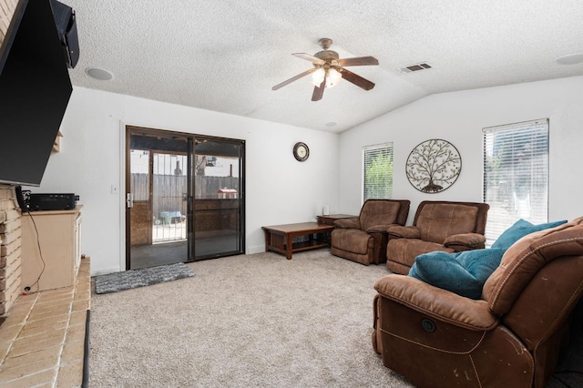 772 W Menlo Ave, Clovis, CA 93612 - carpeted living room with ceiling fan, healthy amount of natural light, lofted ceiling, and a textured ceiling