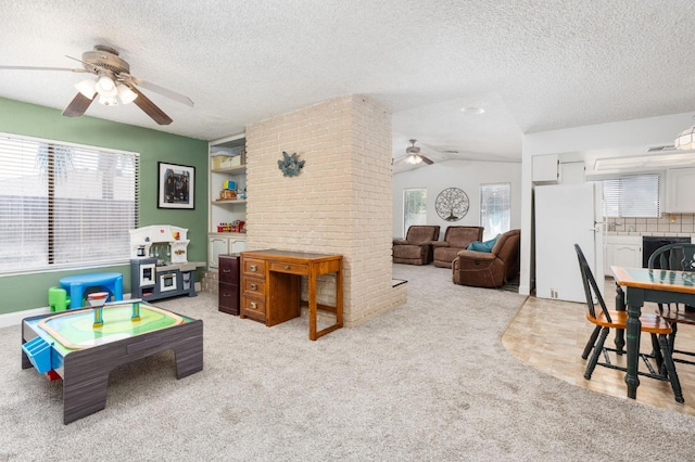 772 W Menlo Ave, Clovis, CA 93612 - recreation room featuring ceiling fan, a textured ceiling, plenty of natural light, light colored carpet, and lofted ceiling
