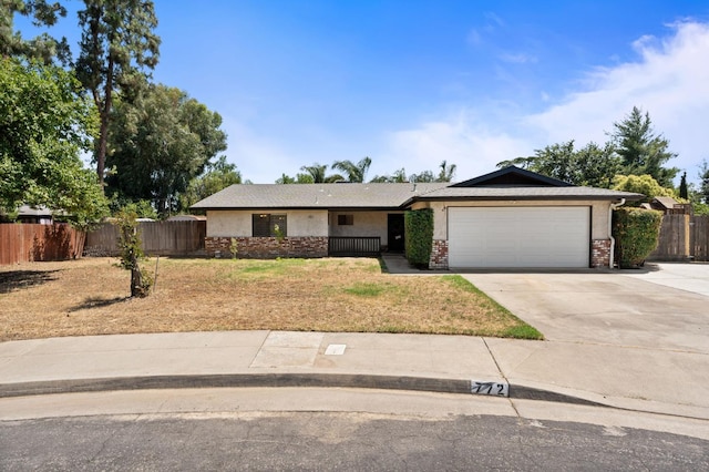 772 W Menlo Ave, Clovis, CA 93612 - ranch-style house with an attached garage, concrete driveway, and brick siding