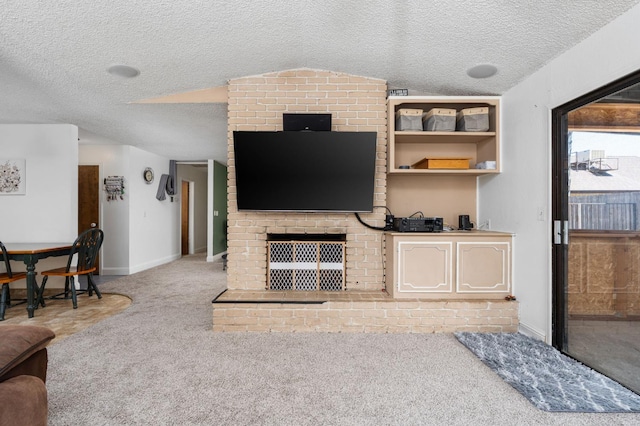 772 W Menlo Ave, Clovis, CA 93612 - carpeted living area with baseboards, a textured ceiling, and a fireplace