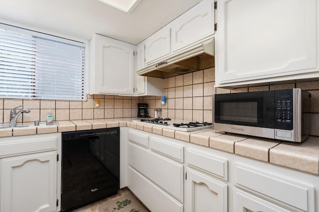 772 W Menlo Ave, Clovis, CA 93612 - kitchen featuring black dishwasher, stainless steel microwave, under cabinet range hood, and white cabinetry
