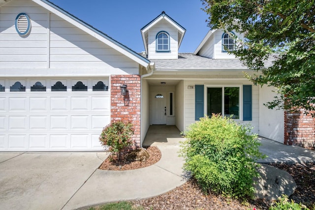 770 N Cherry Ln, Clovis, CA 93611 - view of front facade featuring a shingled roof, an attached garage, brick siding, and concrete driveway