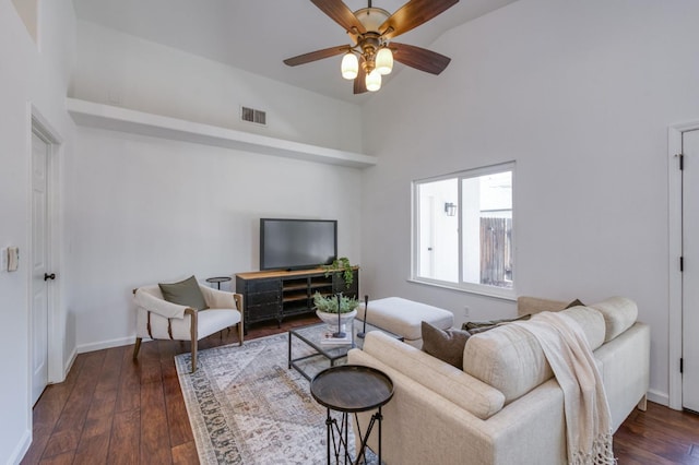 770 N Cherry Ln, Clovis, CA 93611 - living area featuring a ceiling fan, a high ceiling, dark wood-style floors, and baseboards