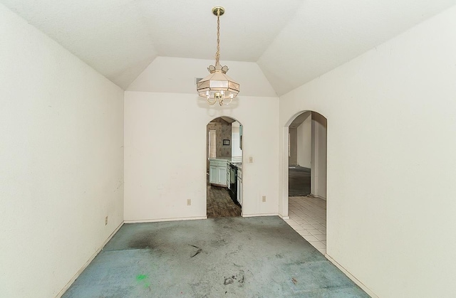 7543 N Spalding Ave, Fresno, CA 93720 - empty room featuring arched walkways, lofted ceiling, and baseboards