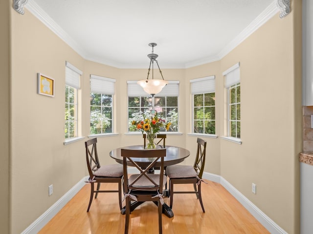 811 E Country View Cir, Fresno, CA 93730 - dining space with light wood-style flooring and ornamental molding