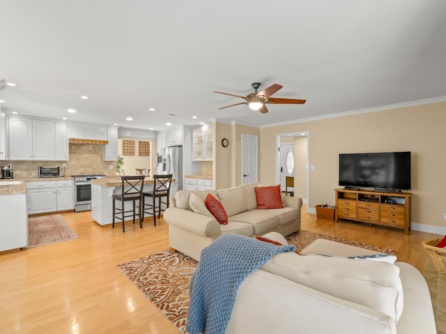 811 E Country View Cir, Fresno, CA 93730 - living room featuring a ceiling fan, light wood-style floors, ornamental molding, and recessed lighting
