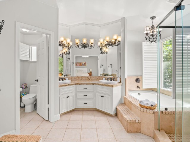 811 E Country View Cir, Fresno, CA 93730 - full bath featuring a chandelier, tile patterned floors, double vanity, and a garden tub