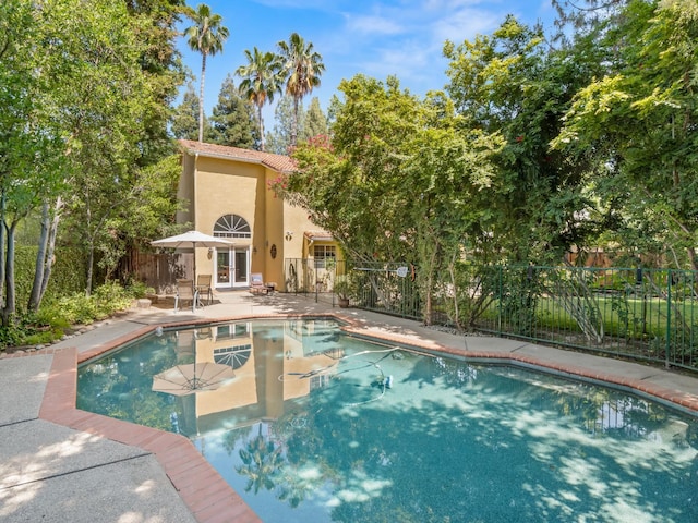 811 E Country View Cir, Fresno, CA 93730 - view of pool featuring french doors and a patio