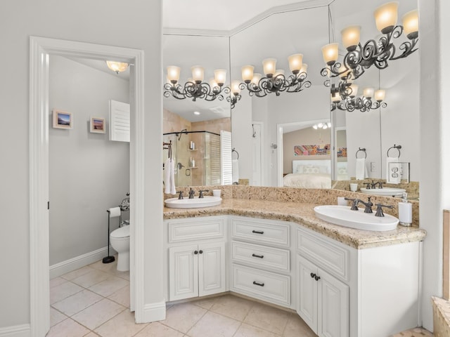 811 E Country View Cir, Fresno, CA 93730 - ensuite bathroom featuring a shower stall, tile patterned flooring, and double vanity