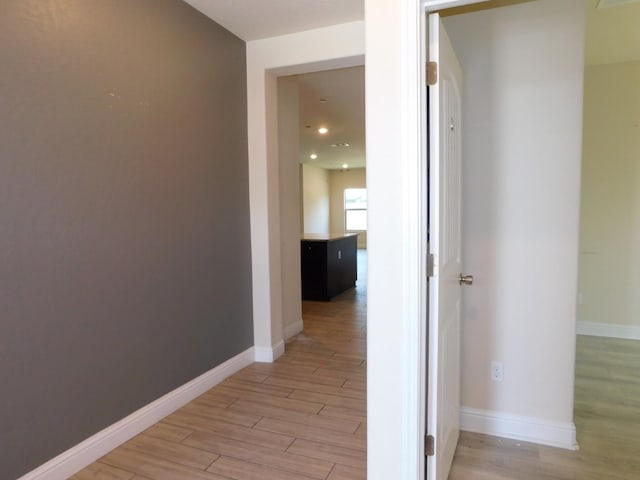 5875 E Pitt Ave, Fresno, CA 93727 - hall featuring light wood-type flooring, baseboards, and recessed lighting