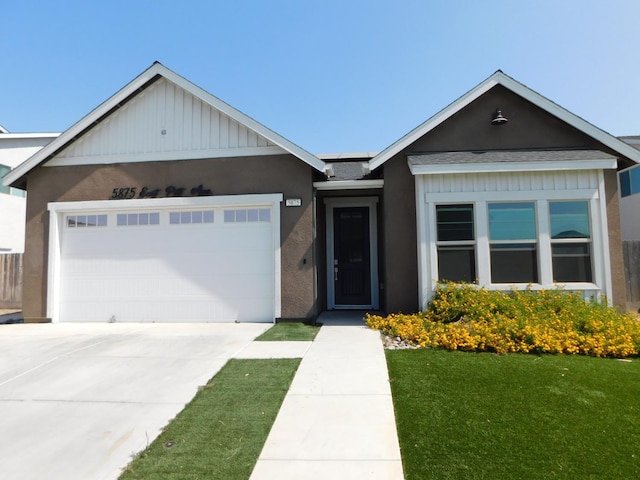5875 E Pitt Ave, Fresno, CA 93727 - ranch-style house featuring an attached garage, concrete driveway, a front yard, and roof with shingles