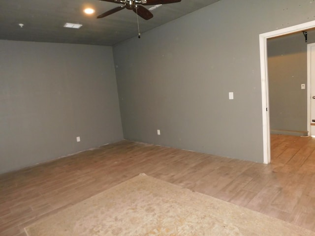 5875 E Pitt Ave, Fresno, CA 93727 - empty room with a ceiling fan and light wood-style floors
