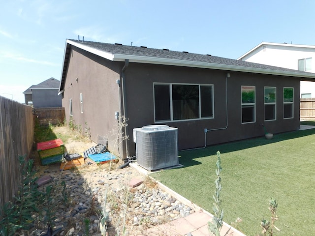 5875 E Pitt Ave, Fresno, CA 93727 - view of side of property with cooling unit and stucco siding