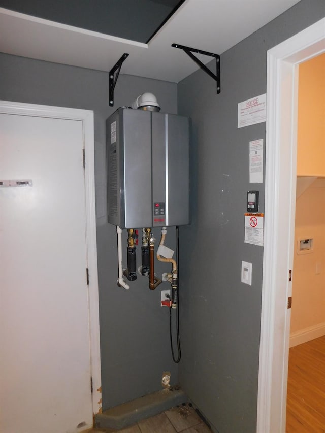 5875 E Pitt Ave, Fresno, CA 93727 - utility room with tankless water heater