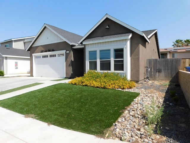 5875 E Pitt Ave, Fresno, CA 93727 - ranch-style house featuring driveway, a garage, a shingled roof, and stucco siding