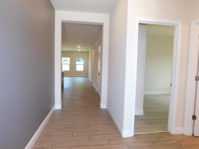 5875 E Pitt Ave, Fresno, CA 93727 - hall featuring light wood-style flooring and baseboards
