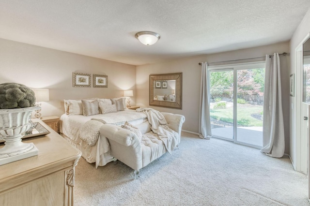 1758 Ash Ave, Clovis, CA 93611 - bedroom with access to exterior, light colored carpet, and a textured ceiling