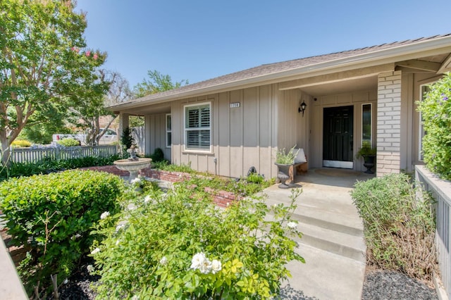 1758 Ash Ave, Clovis, CA 93611 - property entrance featuring board and batten siding and brick siding