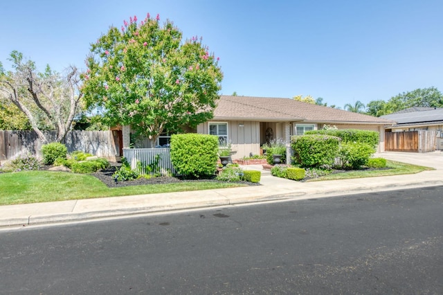 1758 Ash Ave, Clovis, CA 93611 - view of front of house featuring driveway, board and batten siding, and a garage