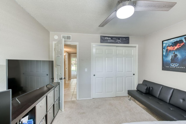 1758 Ash Ave, Clovis, CA 93611 - living room featuring a ceiling fan, light carpet, and a textured ceiling