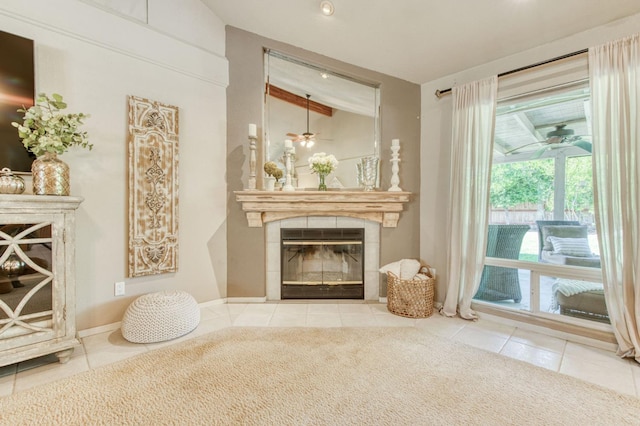 1758 Ash Ave, Clovis, CA 93611 - living room with a fireplace, a ceiling fan, tile patterned flooring, and vaulted ceiling