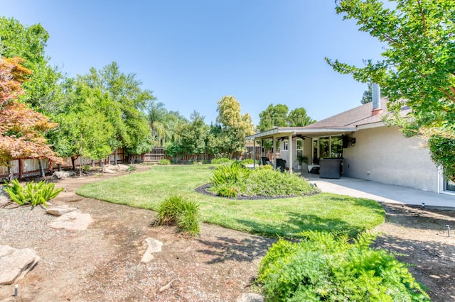 1758 Ash Ave, Clovis, CA 93611 - fenced backyard featuring a patio area and ceiling fan