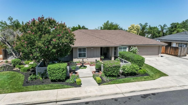 1758 Ash Ave, Clovis, CA 93611 - ranch-style home with driveway, a garage, and board and batten siding