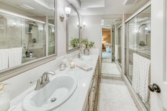 1758 Ash Ave, Clovis, CA 93611 - ensuite bathroom with double vanity, a shower stall, and tile patterned flooring