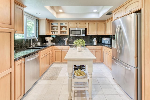 1758 Ash Ave, Clovis, CA 93611 - kitchen with appliances with stainless steel finishes, a raised ceiling, a sink, glass insert cabinets, and recessed lighting