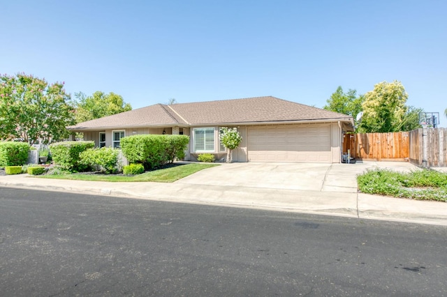 1758 Ash Ave, Clovis, CA 93611 - ranch-style home with a garage and driveway