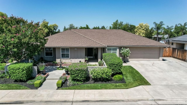 1758 Ash Ave, Clovis, CA 93611 - single story home featuring a garage, driveway, and board and batten siding