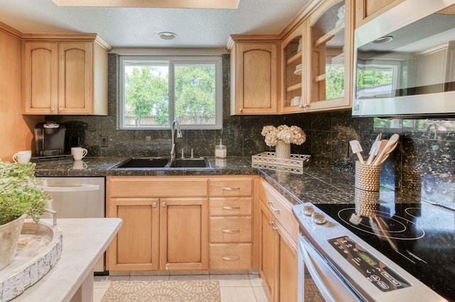1758 Ash Ave, Clovis, CA 93611 - kitchen with stainless steel microwave, a sink, stove, glass insert cabinets, and decorative backsplash
