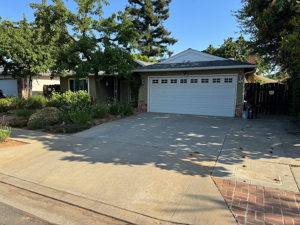 1424 W Chennault Ave, Fresno, CA 93711 - single story home featuring driveway, brick siding, an attached garage, and a chimney