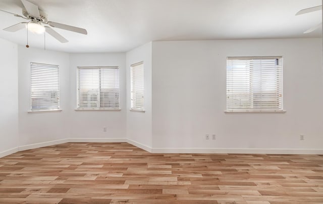 697 E Omaha Ave, Fresno, CA 93720 - unfurnished room featuring ceiling fan, healthy amount of natural light, and light wood-style flooring