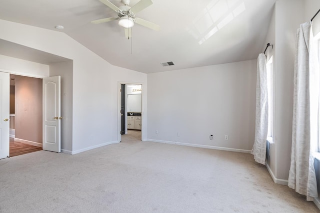 697 E Omaha Ave, Fresno, CA 93720 - unfurnished bedroom featuring vaulted ceiling, light carpet, baseboards, and a ceiling fan