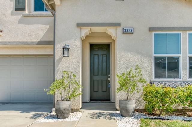 3923 Morris Ave, Clovis, CA 93619 - doorway to property featuring stucco siding and a garage