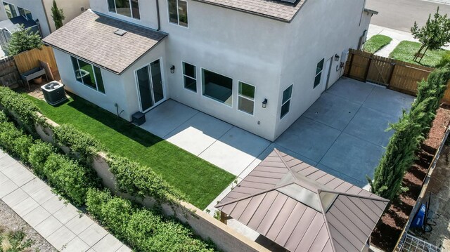 3923 Morris Ave, Clovis, CA 93619 - rear view of property with roof with shingles, stucco siding, a patio, and central AC