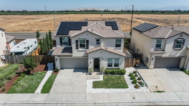 3923 Morris Ave, Clovis, CA 93619 - view of front of home with a garage, driveway, and stucco siding