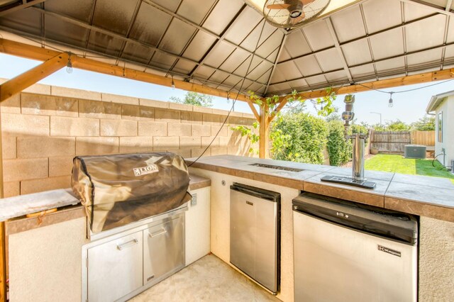 3923 Morris Ave, Clovis, CA 93619 - fenced backyard with an outdoor kitchen and a gazebo
