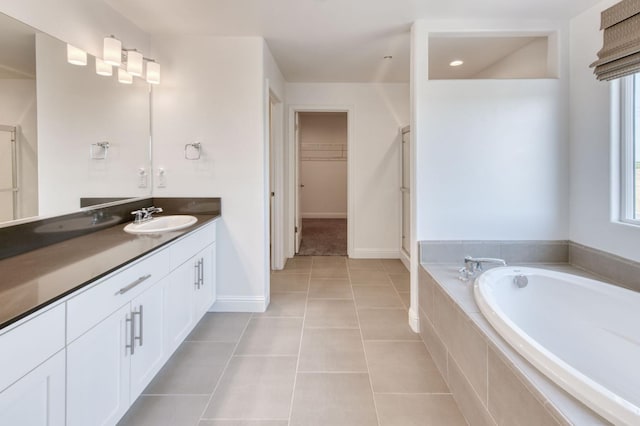 3923 Morris Ave, Clovis, CA 93619 - full bath with vanity, a bath, tile patterned flooring, a spacious closet, and a shower stall