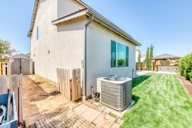3923 Morris Ave, Clovis, CA 93619 - rear view of property with cooling unit, a gazebo, stucco siding, and a patio area
