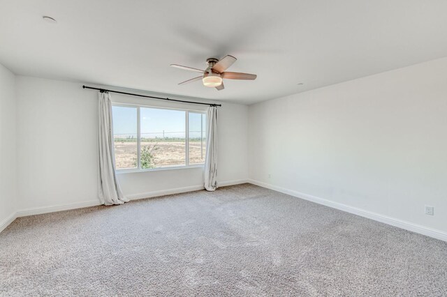 3923 Morris Ave, Clovis, CA 93619 - empty room featuring a ceiling fan, baseboards, and light colored carpet