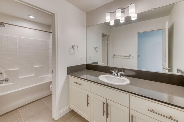 3923 Morris Ave, Clovis, CA 93619 - bathroom featuring toilet, tile patterned flooring, vanity, shower / washtub combination, and baseboards
