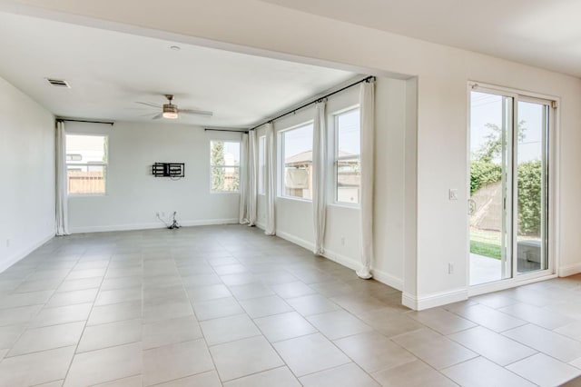 3923 Morris Ave, Clovis, CA 93619 - unfurnished room featuring a ceiling fan, light tile patterned flooring, and baseboards