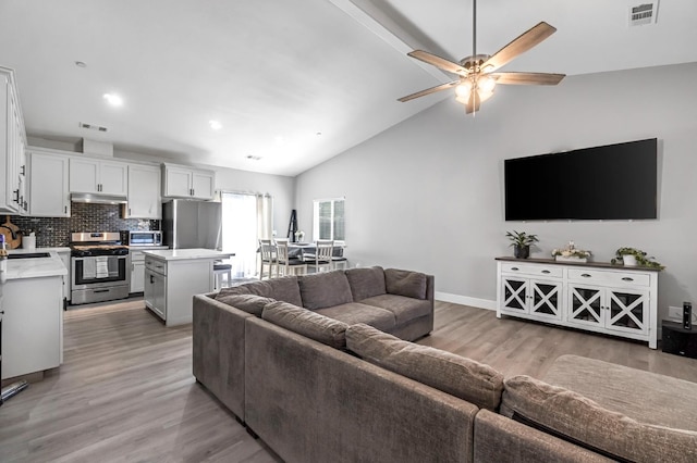 22375 Fairmead Cir, Chowchilla, CA 93610 - living area with light wood-style flooring, ceiling fan, high vaulted ceiling, and recessed lighting